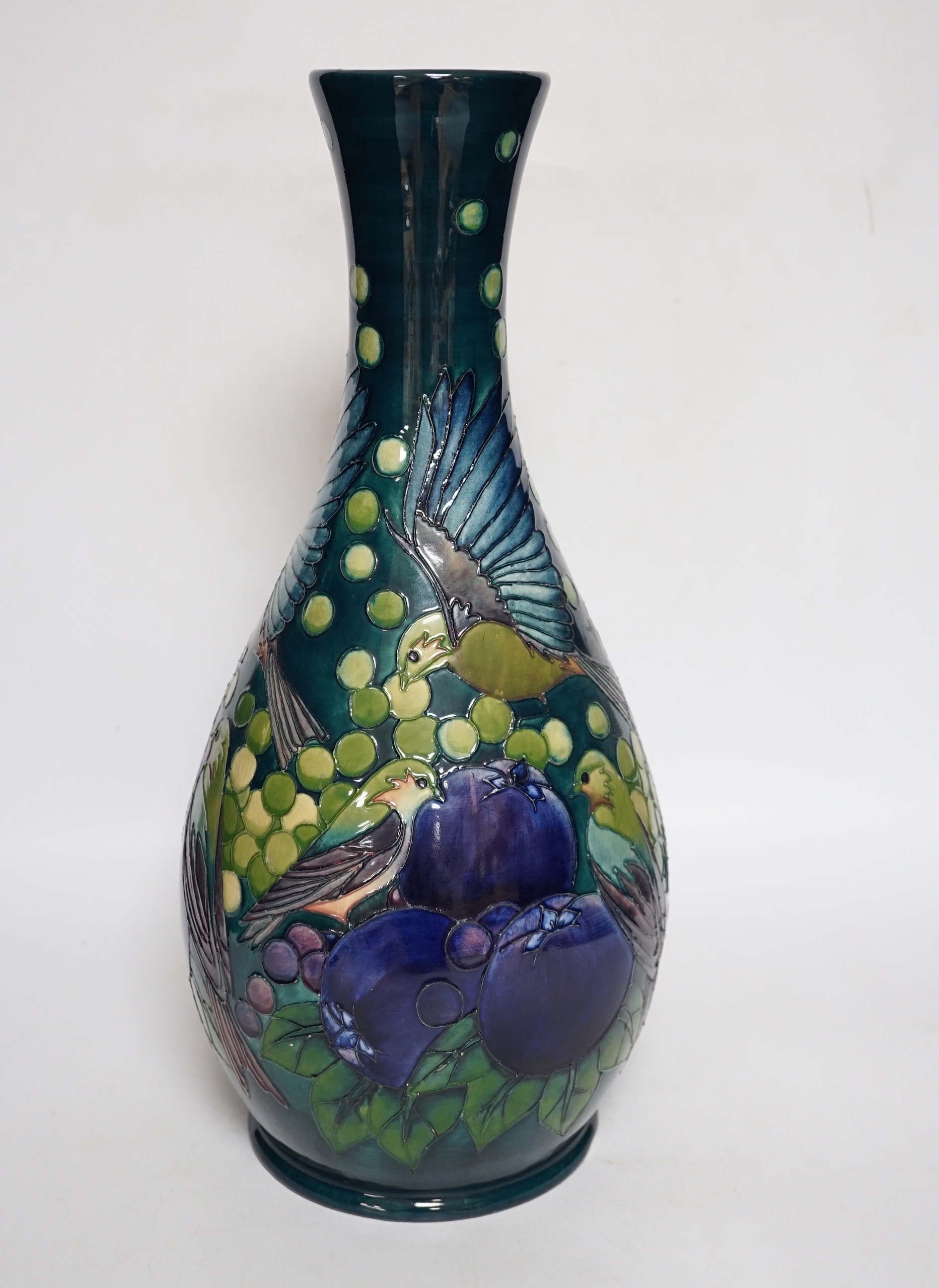 A large boxed Moorcroft vase, ‘Finches pattern’, on a dark blue-green ground, bell date mark to base, signed LS and dated 27.8.92, 42cm high